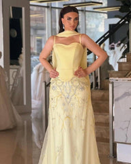 فستان سهرة أصفر ملكي بتفصيل كورسيه وتطريز فاخر – لمسة فخامة استثنائية