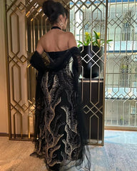 فستان سهرة أسود فاخر بتطريز كريستالي وأكمام شيفون – تصميم ملكي جذاب