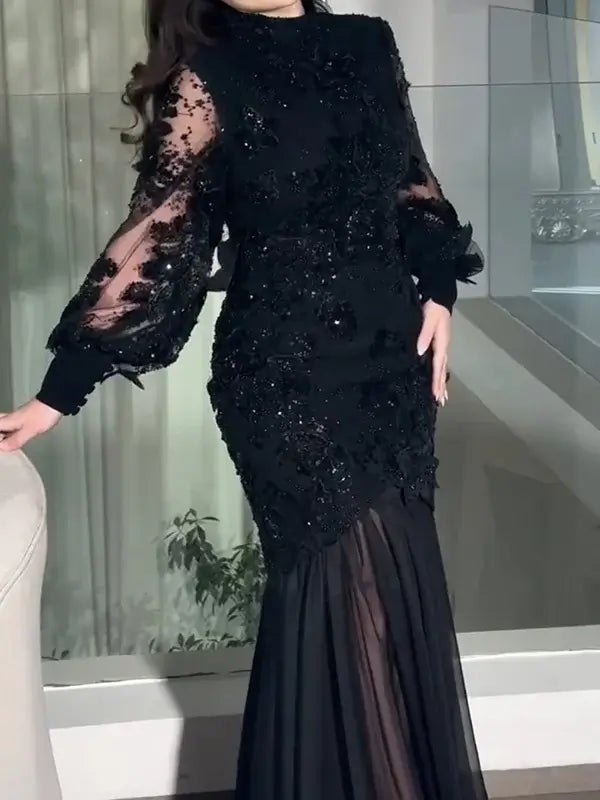 فستان سهرة أسود فاخر بتطريز يدوي وأكمام شفافة راقية