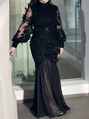 فستان سهرة أسود فاخر بتطريز يدوي وأكمام شفافة راقية