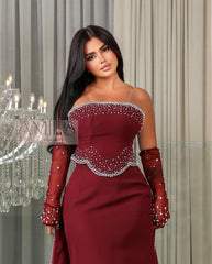 فستان سهرة عنابي أنيق بتطريز فخم ولمسات لامعة